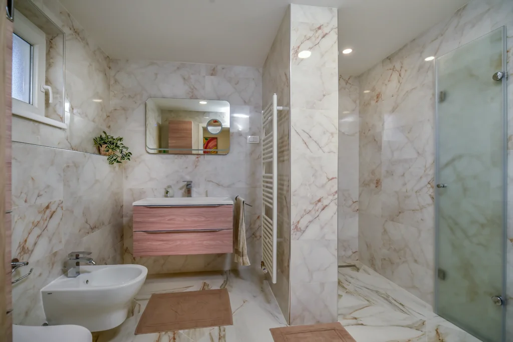 Clean modern bathroom with walk-in shower at SEDAMI apartment near Maribor highway