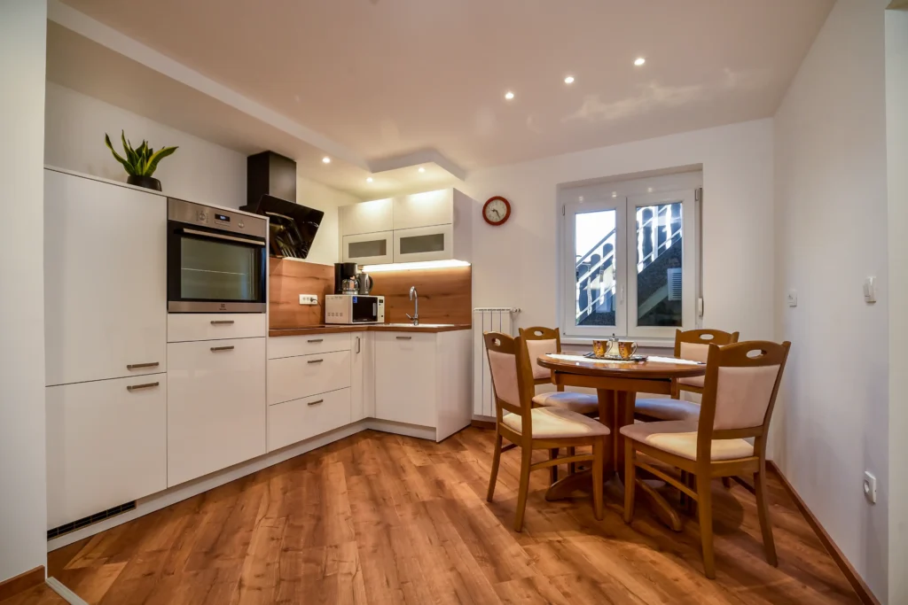 Modern kitchen with dining area in SEDAMI apartment in Maribor, near highway